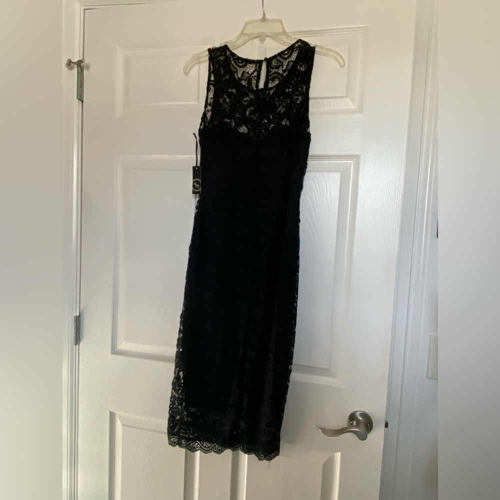 Brand new with tags black‎ lace . Junior size small